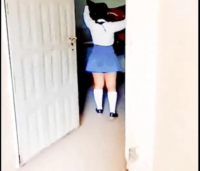 Sneak a Peek at this Naughty Schoolgirl in the Bathroom Stall!