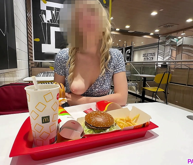Wow, what a sight! A busty blonde slut flashes her wet pussy and masturbates in public at a restaurant